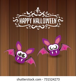 vector happy halloween greeting card. halloween design template background with bat and calligraphic halloween text on wooden background