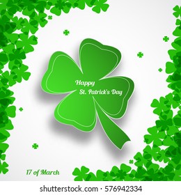 Vector Happy St. Patrick's Day poster on the white background with green leaf of clover shape cut from paper, shadow, text and clover leaves arranged at corners.