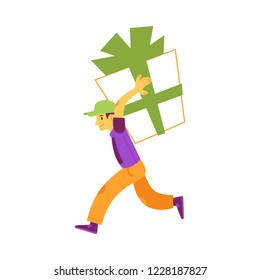 Vektor glücklich junge Mann laufen mit riesigen Geschenk-Box mit grünen Umhüllungsband, Bogen halten es an Schultern. Geburtstag, Jubiläum, Weihnachten oder Neujahr Feiertage Überraschungsgeschenk