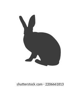 Silueta de la liebre vectorial aislada en blanco. Conejo negro con fondo blanco.	Silueta de conejo. Elemento de Pascua. Símbolo de año nuevo