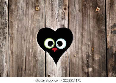 Vector heart carved in wood with face of animal looking through. symbol of toilet and rustic.