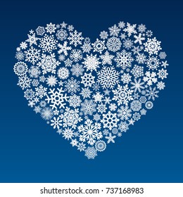 vector heart made of little snowflakes on blue background