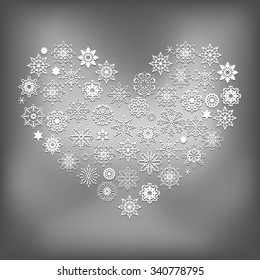 Vector Heart Made of White Snowflakes