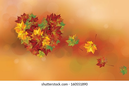 Vector heart shape made of leaves on autumn  background.