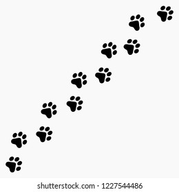 Vector high quality illustration of paw prints silhouette making a path on the ground - isolated on white background