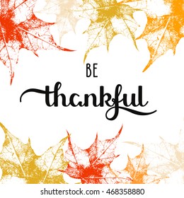 vector holiday background with autumn maple leaves and hand drawn words be thankful