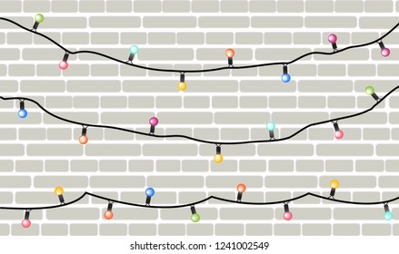 Vector holiday garlands with colorful lamps on a brick wall background