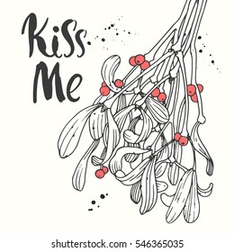 Vector holiday illustration Kiss Me on white background with green branch of mistletoe. Handwritten inscription. Lettering design. Sketch style.