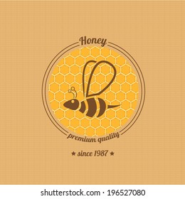 vector honey bee icon on honeycomb background. abstract bee silhouette. honey vintage label or sticker