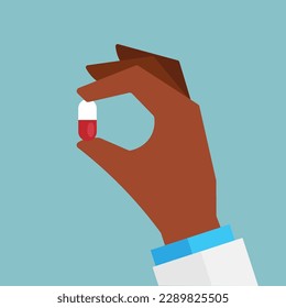 Vector human hand holding pill between fingers. Illustration in a flat style. Medical treatment and healthcare