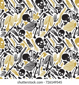 Vector human skeleton halloween black golden luxury seamless pattern with skulls and other various single human parts bones.