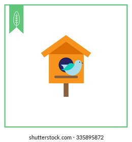Vector icon of birdhouse and blue bird
