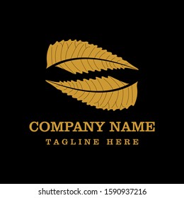 Vector icon of a gold leaf isolated on a black background. Logo design template. Vector illustration