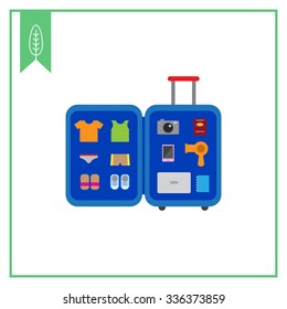 Vector icon of open travel suitcase with various items inside