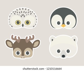 Vector icon set of cute snowy winter animals: snowy owl, penguin, reindeer and polar bear. Animal masks for children. 