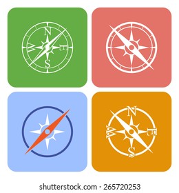 Vector icons depicting four different compasses on a color buttons
