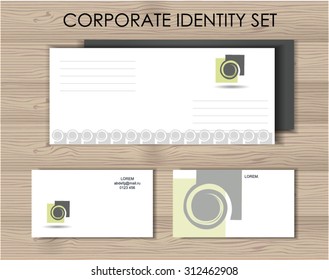 vector identity set on the wooden background. envelope and business card with stylized vacuum cleaner logo