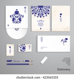 Vector identity templates. Envelope, business card, cards, tag, disc with packaging, pencils. Lotus flowers and leaves are painted by watercolor. Imitation of chinese porcelain painting.