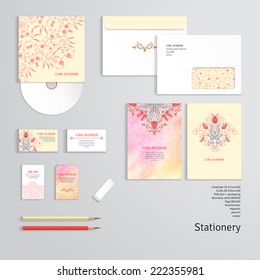 Vector identity templates. Letterhead, envelope, business card, tag, disc with packaging, pencils. Tulip flower floral ornament and decor with leaves. Delicate colored pencil background. Hand drawing.