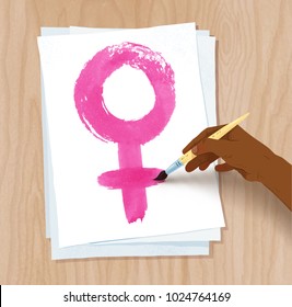 Vector illustration of african american female hand drawing woman symbol with brush on paper on light wooden desk background.