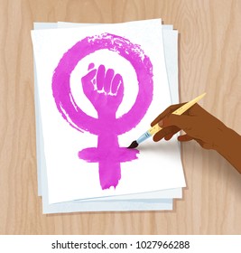Vector illustration of african american female hand drawing Feminism protest symbol with brush on paper on light wooden desk background.