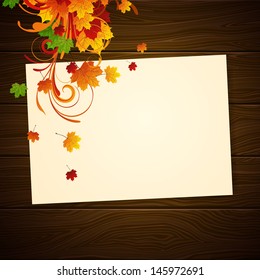 Vector Illustration of an Autumn Background with Leafs