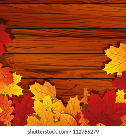 Vector Illustration of Autumn Leaves on the Background of a Wooden Wall