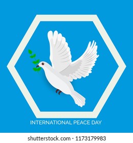 Vector illustration of a Background for International Peace Day with dove and olive branch. 