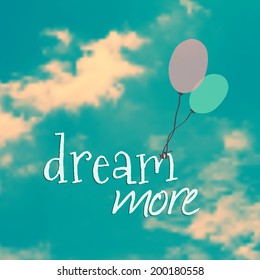 Vector illustration with balloons in blue sky and phrase "dream more"