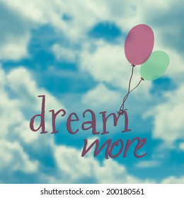 Vector illustration with balloons in blue sky and phrase "dream more"