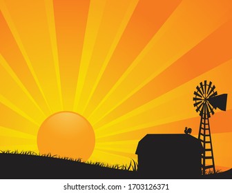 A vector illustration of a barn and windmill of a farm in silhouette against a rising or setting bright orange sun