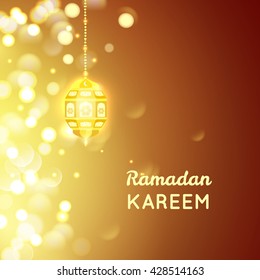 Vector illustration of Beautiful Golden lamp , Ramadan Kareem greeting on gold bokeh background.