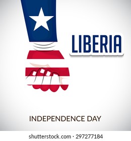 Vector illustration of a beautiful Hand Covered with Liberia Flag for Liberia Independence Day.