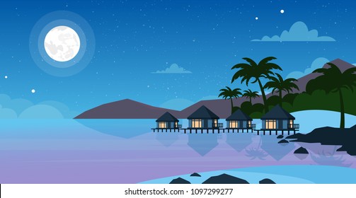 Vector illustration of beautiful night sea beach with hotel. Small villas on the ocean seaside in night time with moon and stars on the sky. Summer landscape, vacation concept in flat style.