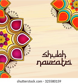  Vector illustration of beautiful rangoli with colourful background for Happy Navratri festival.