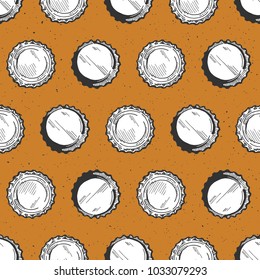 Vector illustration of a beer bottle caps or lids seamless pattern on a beer yellow color background. Hand drawn vintage grunge style.