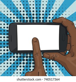 Vector illustration of black afro hand holding smartphone horizontally and finger pointing blank screen in the middle, on pop art background of blue rays and halftone dots