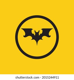 vector illustration of black bat logo on yellow background