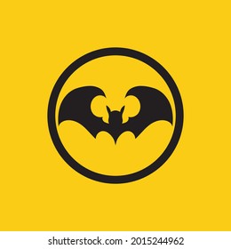 ilustración vectorial del logotipo de murciélago negro sobre fondo amarillo