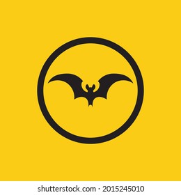 ilustración vectorial del logotipo de murciélago negro sobre fondo amarillo