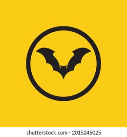 ilustración vectorial del logotipo de murciélago negro sobre fondo amarillo