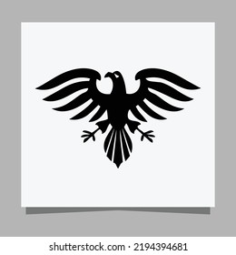 Vector illustration of a black eagle on white paper which is perfect for logos, business cards, posters and icons