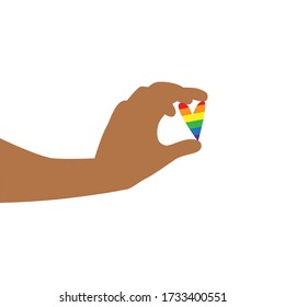 Vector illustration of black hand carefully holding little heart in rainbow LGBT flag colors. IGBT, freedom love, gay pride concept. Freedom of speaking