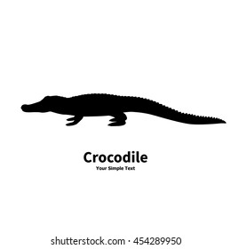 Vector illustration of black silhouette of crocodile isolated on white background. Croc side view profile.