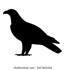 Vector illustration of a black silhouette of a standing eagle. Isolated white background. Eagle logo icon, side view profile.