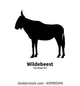 Vector illustration of black silhouette of wildebeest on the isolated white background. Wildebeest side view profile.