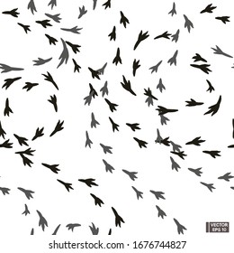 Vector illustration. Black and white bird tracks silhouette seamless patterns.