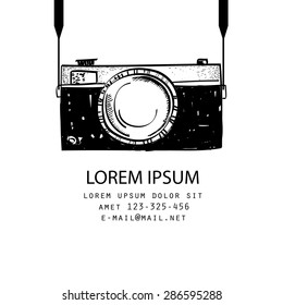 Vector illustration of a black and white photo camera, doodle style, isolated on white