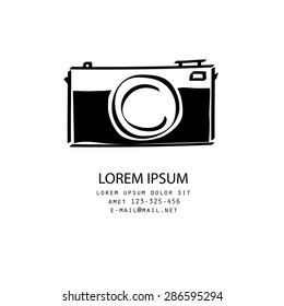 Vector illustration of a black and white photo camera, doodle style, isolated on white