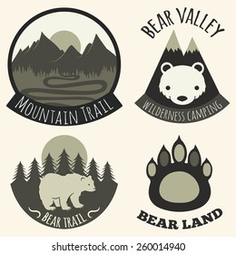 Vector illustration. Black and white set of camping emblems, labels and badges with mountains, trees and bears. Bear land, valley, mountain trail